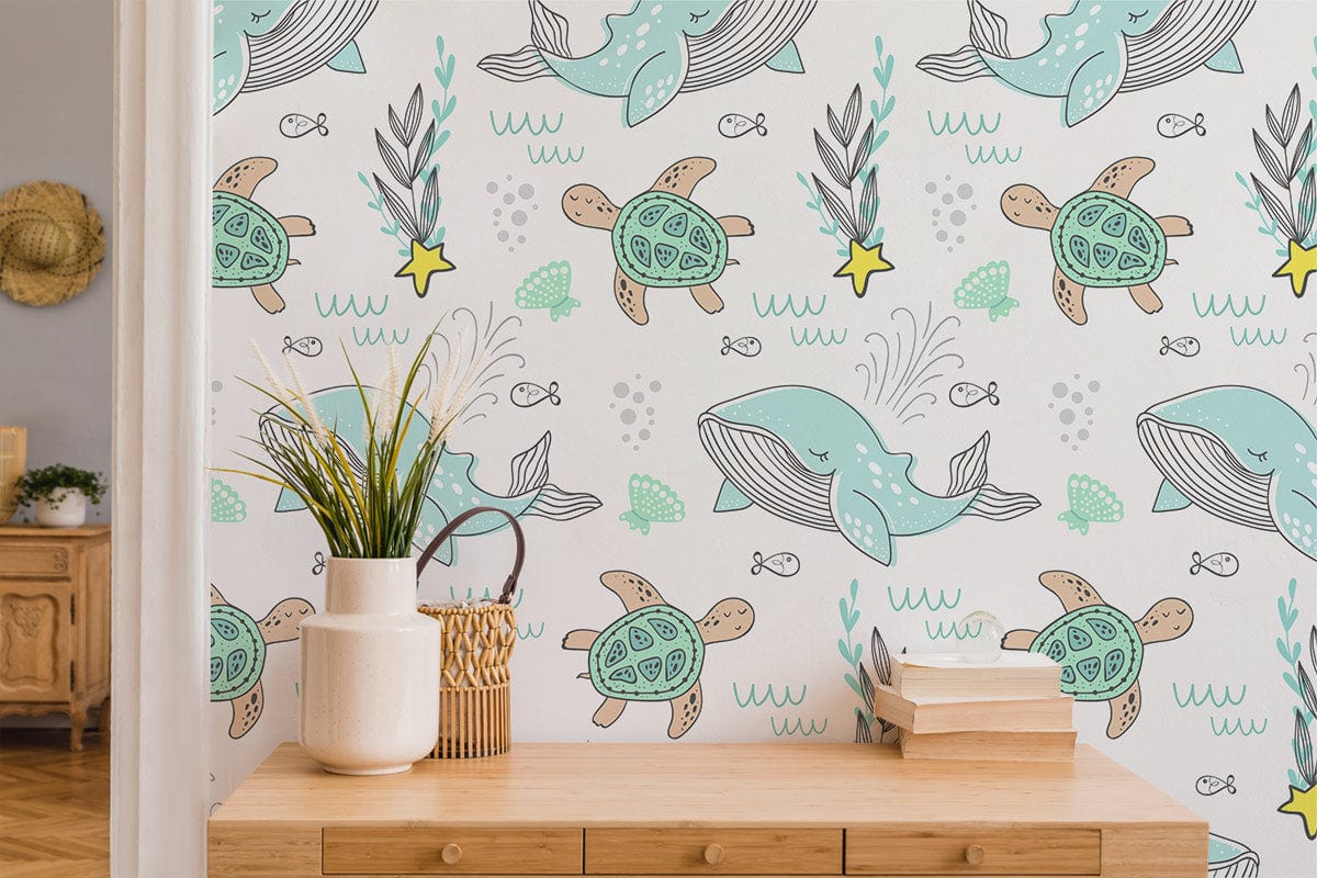 Sea Life Adventure Kids' Wallpaper features whales and turtles in pastel hues with wooden dresser, plants.