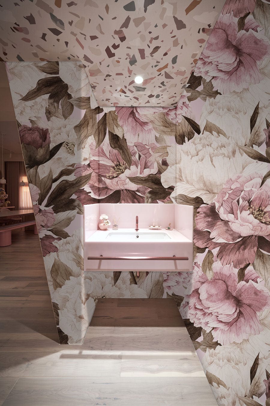 Elegant vintage floral wallpaper in bathroom, featuring pastel blush peony pattern, light wood flooring.
