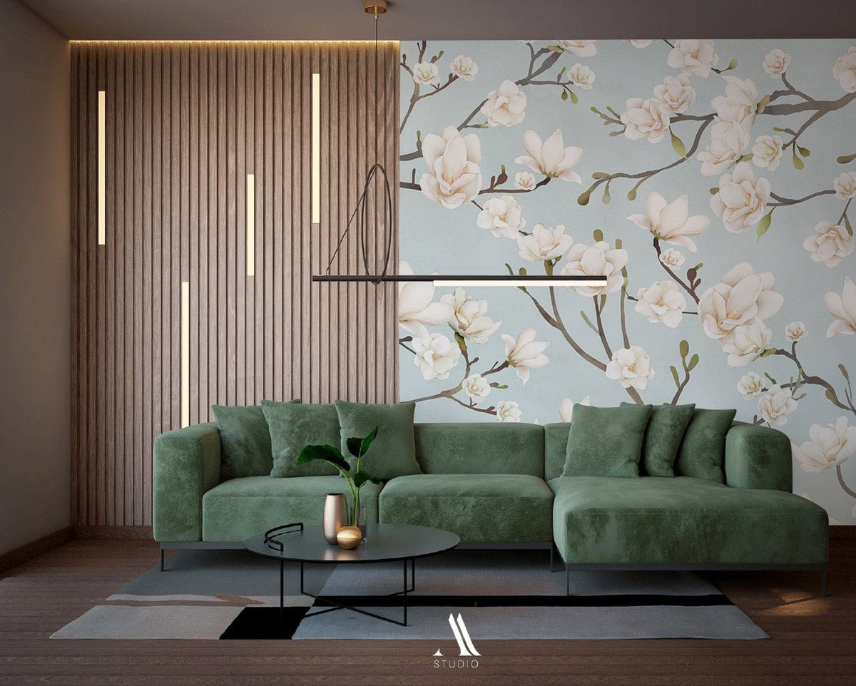 Serene Blue Magnolia Blossom Floral Wallpaper, green sofa, modern living room, wooden flooring, elegant decor.