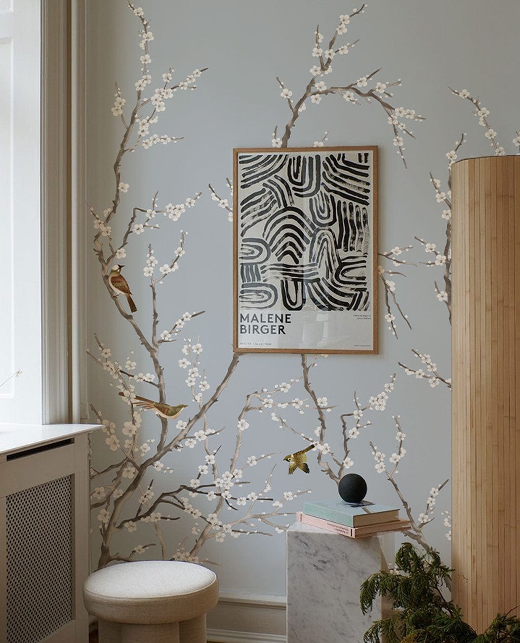 Elegant Blue Bird Blossom wallpaper with nature theme decorates light-coloured wall, framed art accent.