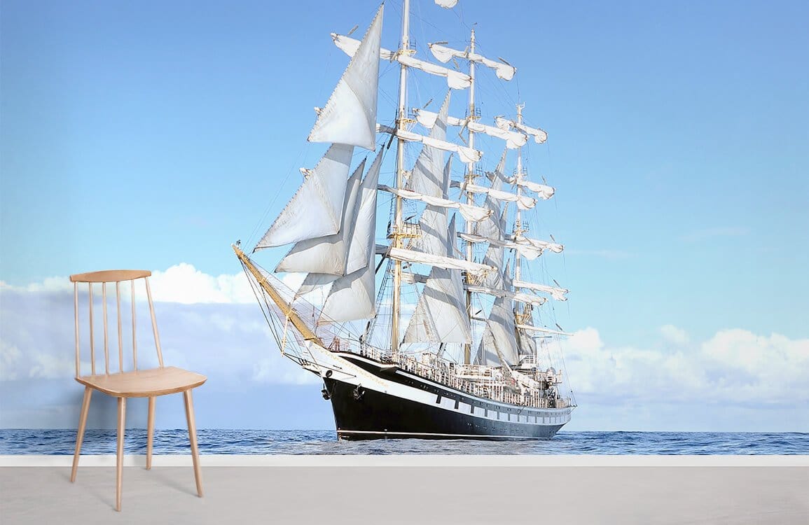 Classic Nautical Sailing Ship Mural Wallpaper, serene blue hues, minimalist chair, contemporary room setting.