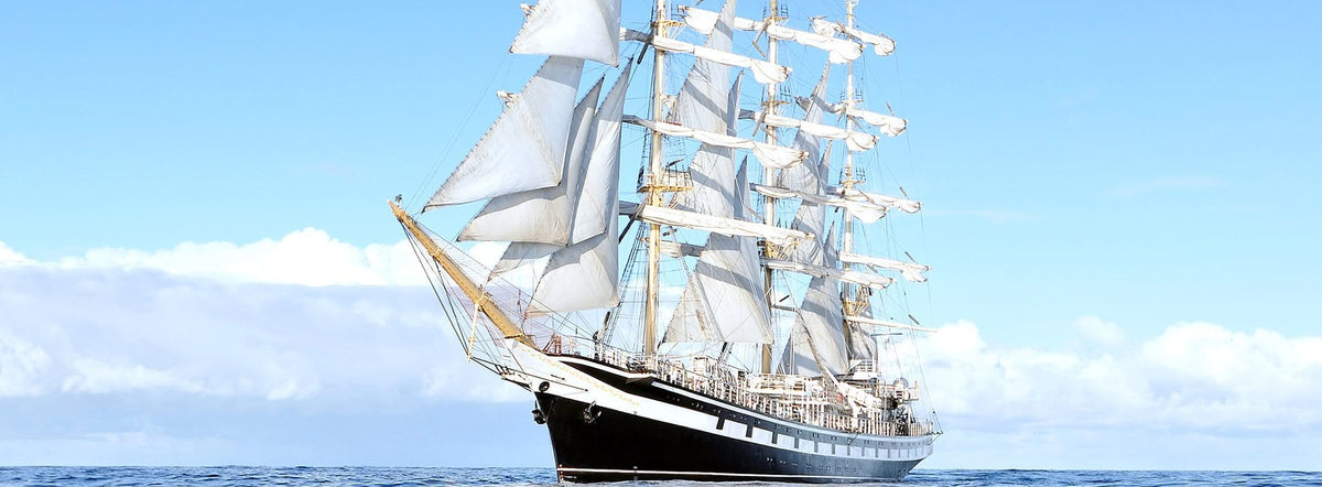 Classic Nautical Sailing Ship Mural Wallpaper in Serene Blue Tones