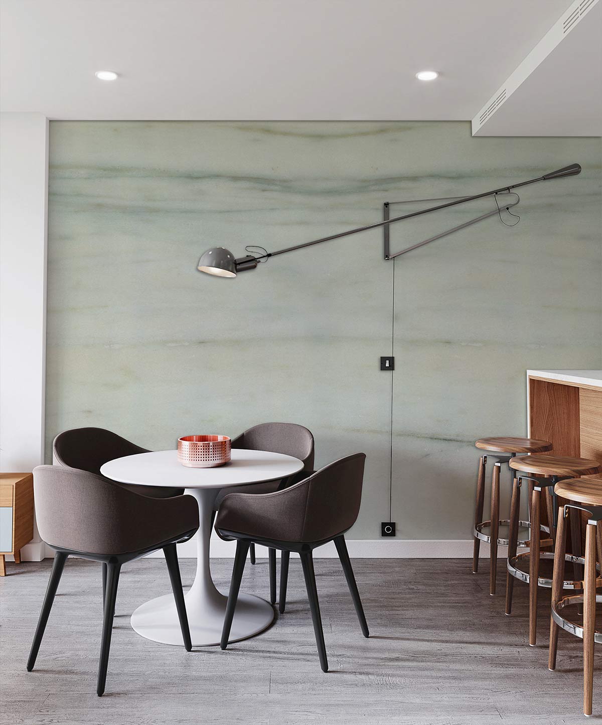Elegant marble effect wallpaper in dining area with grey chairs, round table, wooden flooring, wall lamp.
