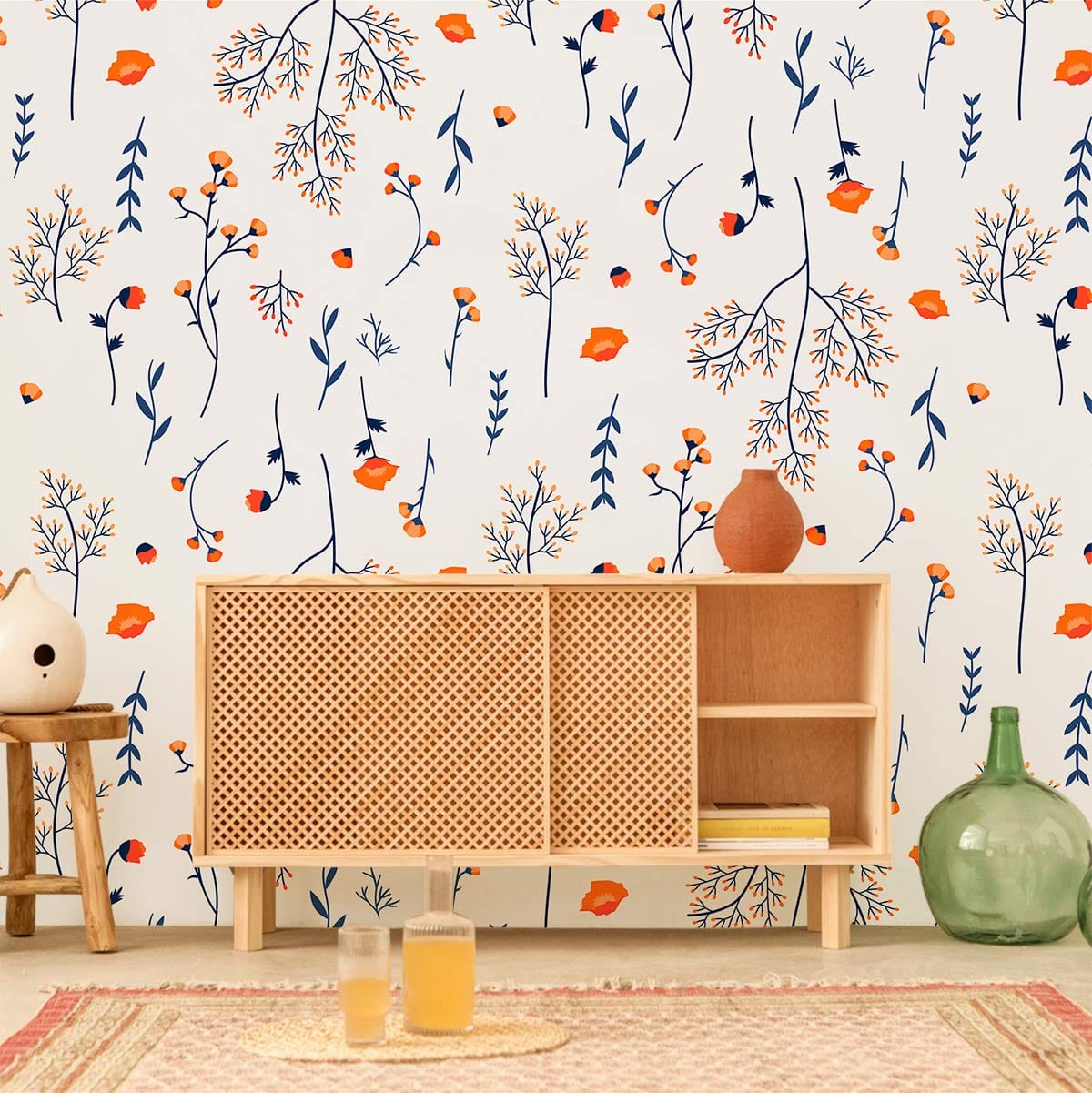 Elegant botanical autumn leaf pattern wallpaper with wooden sideboard, rug, and small decor items in room.