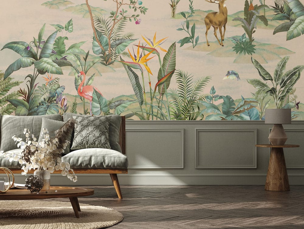 Lush green botanical mural in living room with grey sofa, wooden flooring, and unique side table.