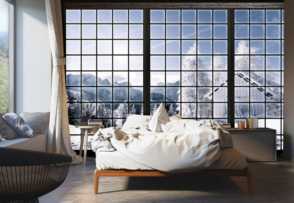Winter Wonderland Snowy Mountain Escape mural wallpaper, featuring modern bedroom with wooden bed and grey flooring.