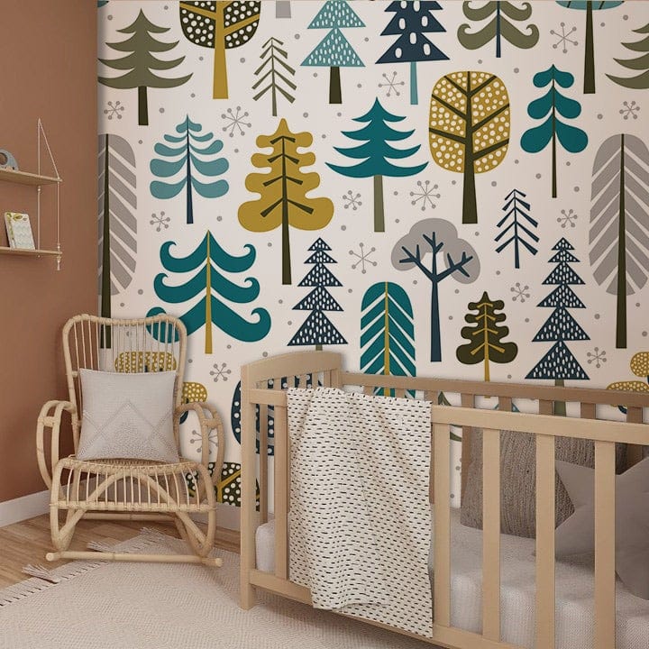 Scandi Woodland Wallpaper in nursery with rattan chair, wooden cot, retro style trees, warm flooring.