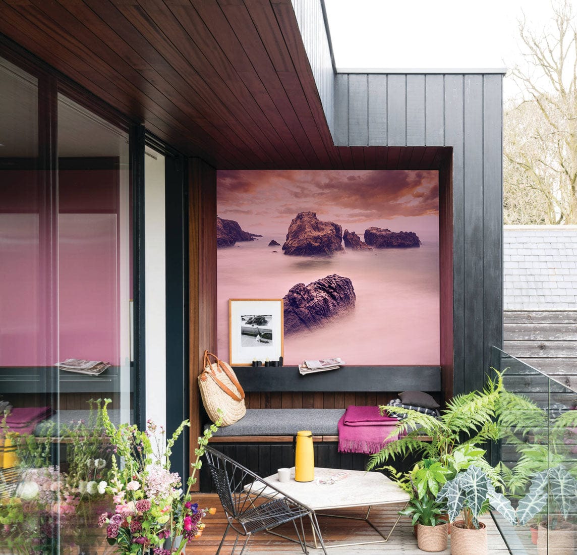 Serene Coastal Sunset Mural Wallpaper - Tranquil Seascape in Soft Hues, modern patio setting, wooden accents.