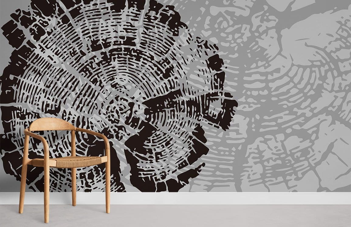 Grey and Black Tree Rings modern wallpaper featuring natural texture with wooden chair, minimalist room setting.