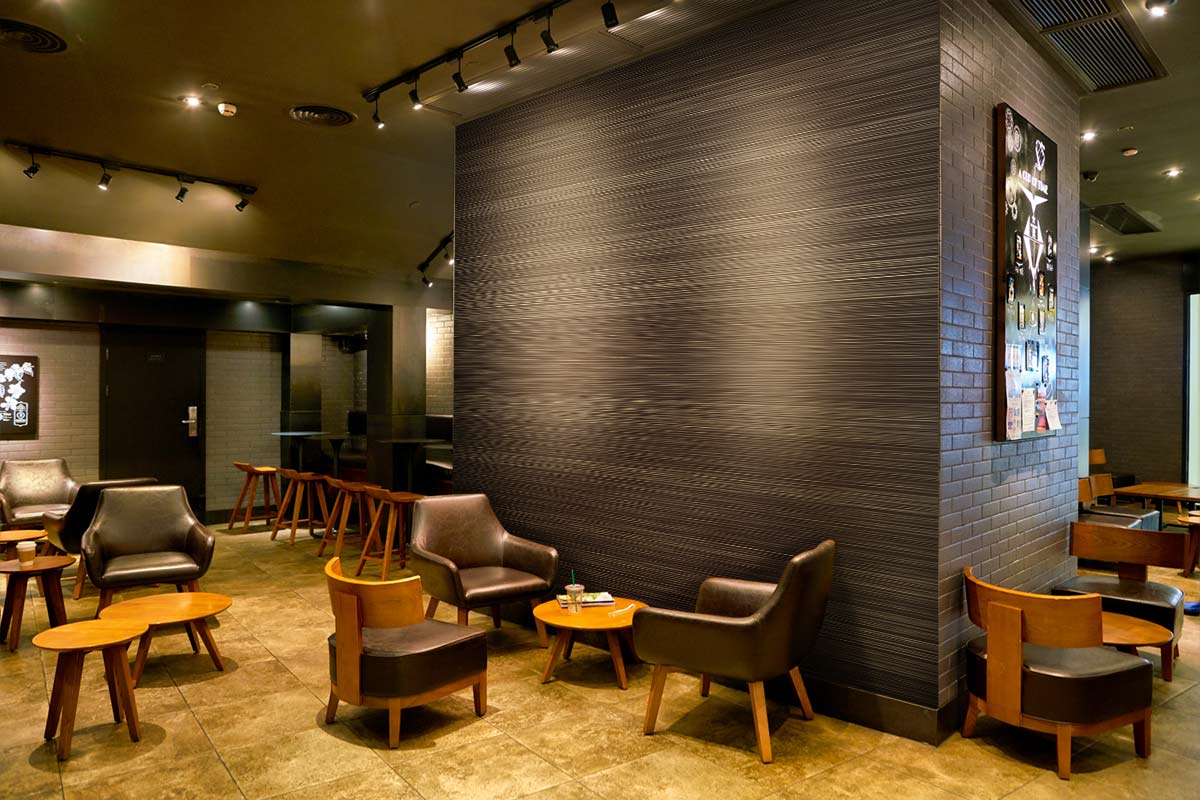 Luxurious lounge with Earthy Taupe Textured Stripe Wallpaper, leather chairs, wooden tables, elegant flooring.