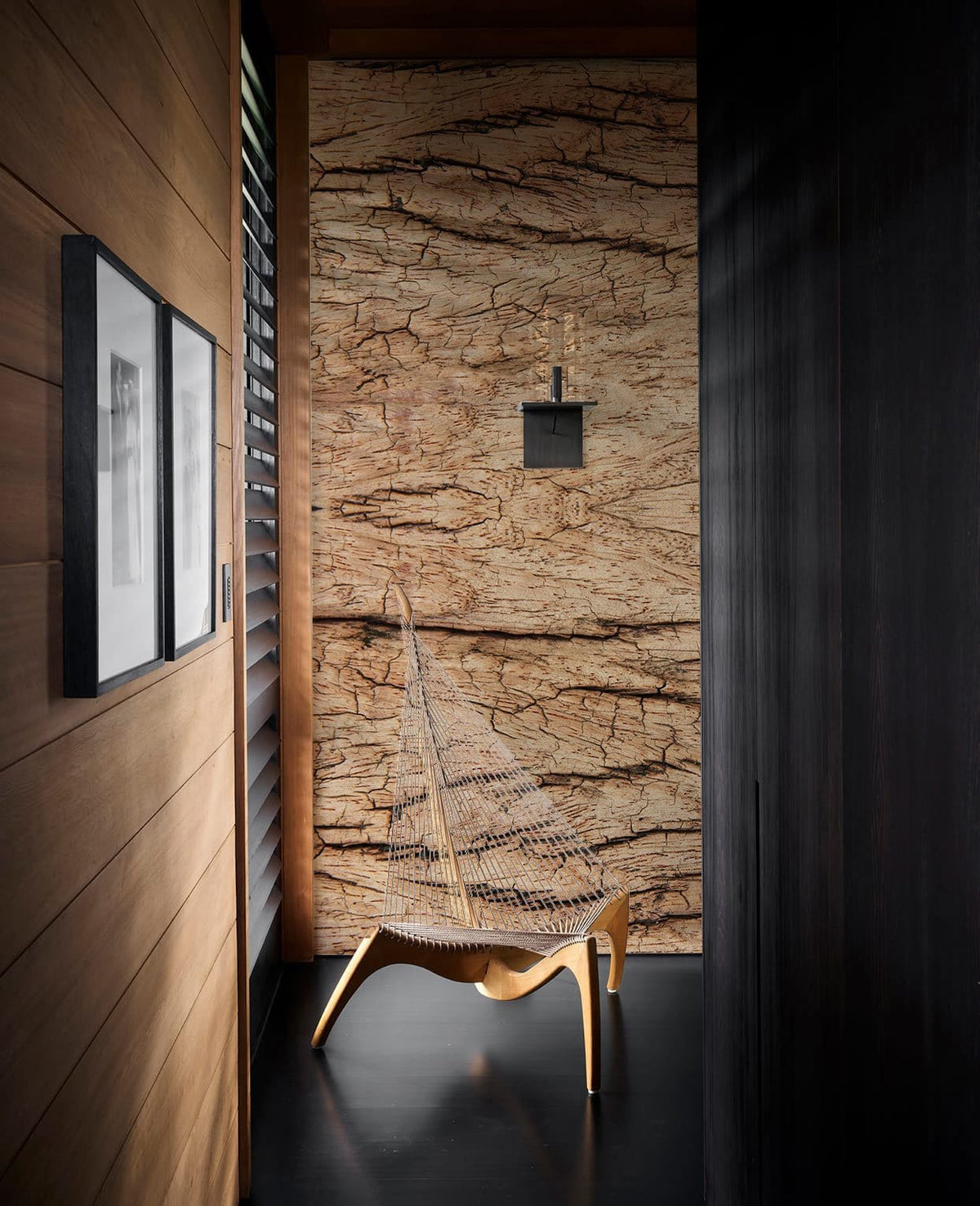 Natural rustic wood texture wallpaper, contemporary chair, dark wood flooring, cozy home hallway Décor.