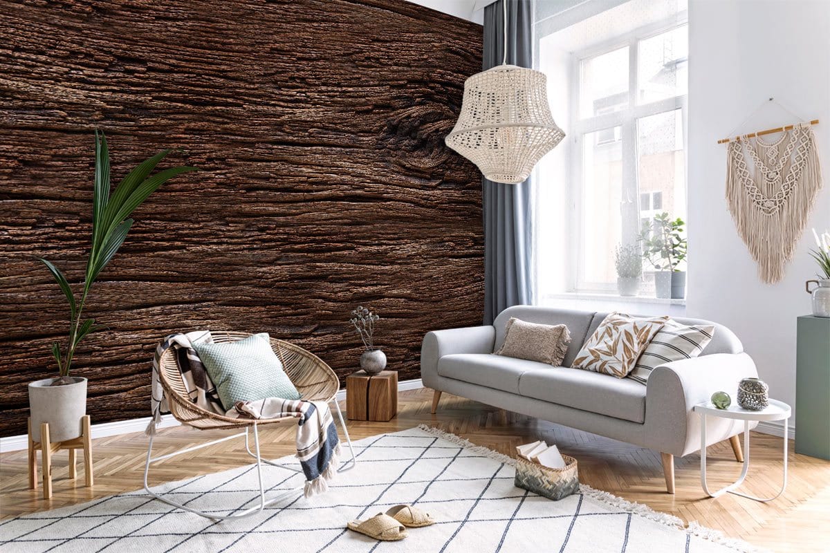 Cosy living room featuring Rustic Dark Wood Texture Mural Wallpaper, grey sofa, wicker chair, wood flooring.