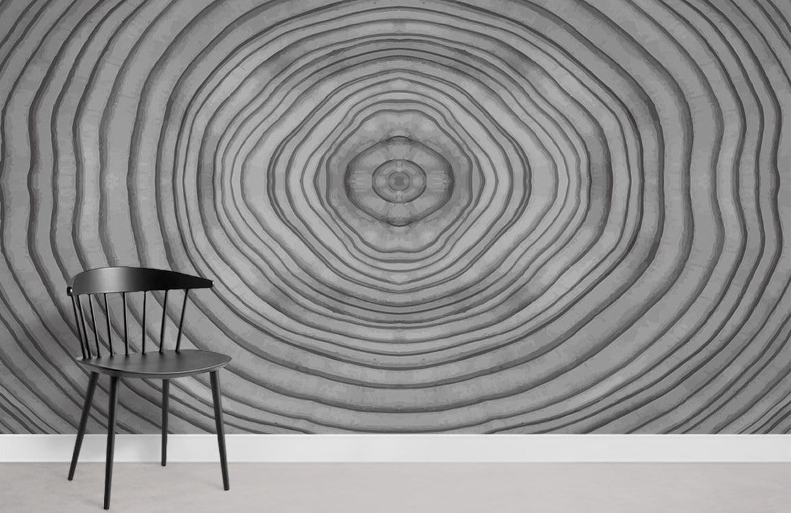 Grey concentric circles wallpaper, modern style, black chair, white skirting, light flooring, geometric decor.