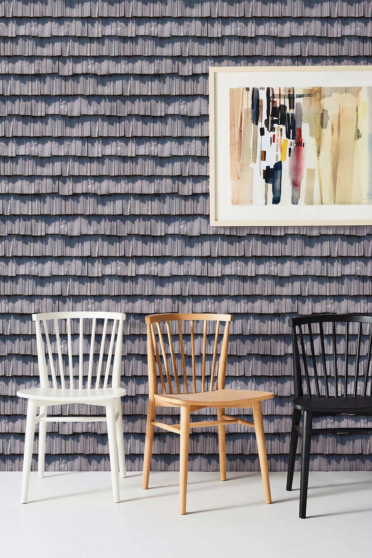Elegant grey coastal wallpaper with wooden chairs, abstract wall art, and modern decor elements.
