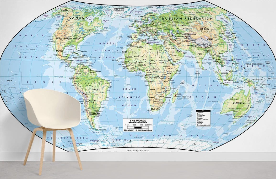 Vintage style world map mural wallpaper with white modern chair, grey flooring, and vibrant global colours.