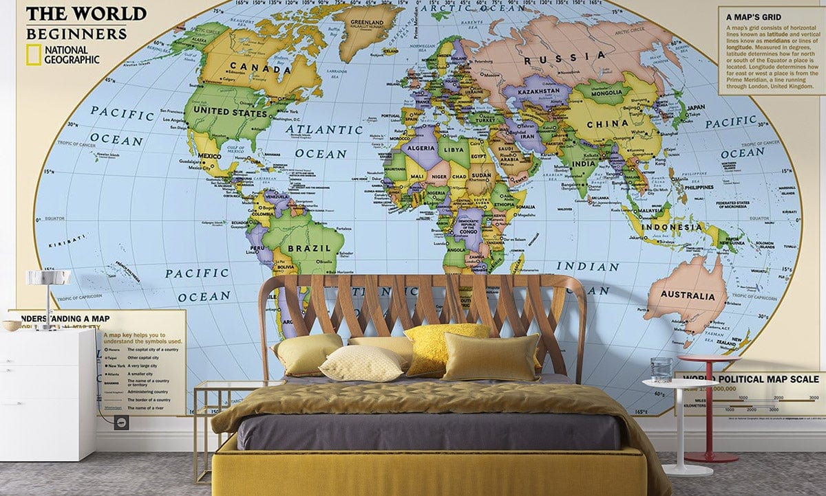 Vintage multicoloured educational world map mural wallpaper, National Geographic The World, bedroom setting, modern furniture.