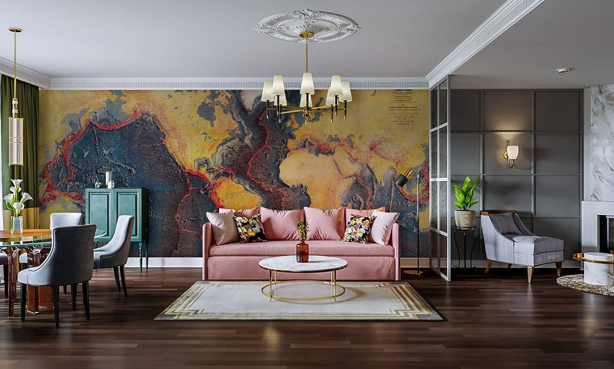 Vintage world map mural in vibrant colours with pink sofa, dining set, dark wood flooring, chandelier.