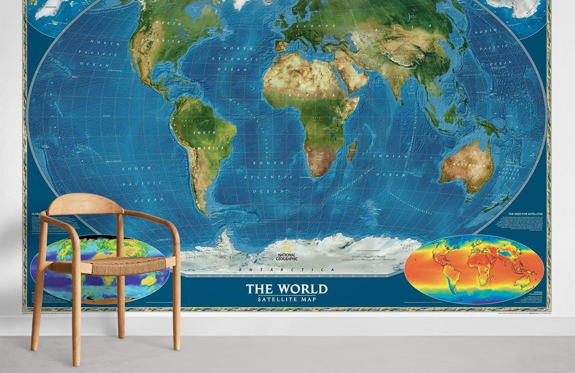 Vibrant world map mural wallpaper with satellite colours, wooden chair, grey flooring in educational space.