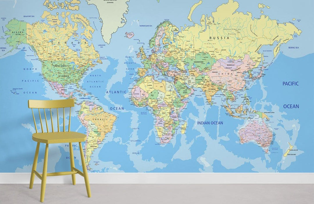 Vintage world map mural wallpaper, pastel colours with yellow chair, ideal for educational room decor.