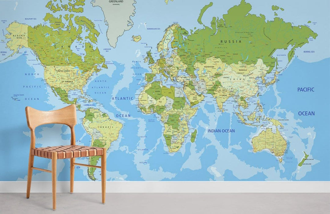 Vintage world map mural wallpaper in blue and green tones, beige chair, white wall, minimalist decor.