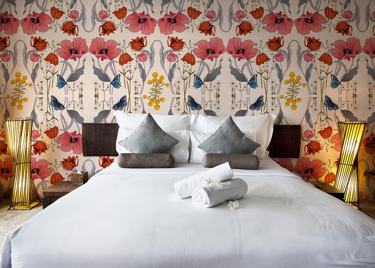 Vintage wallpaper with red poppies, butterflies, modern bedroom, stylish bed, elegant lighting, neutral flooring.