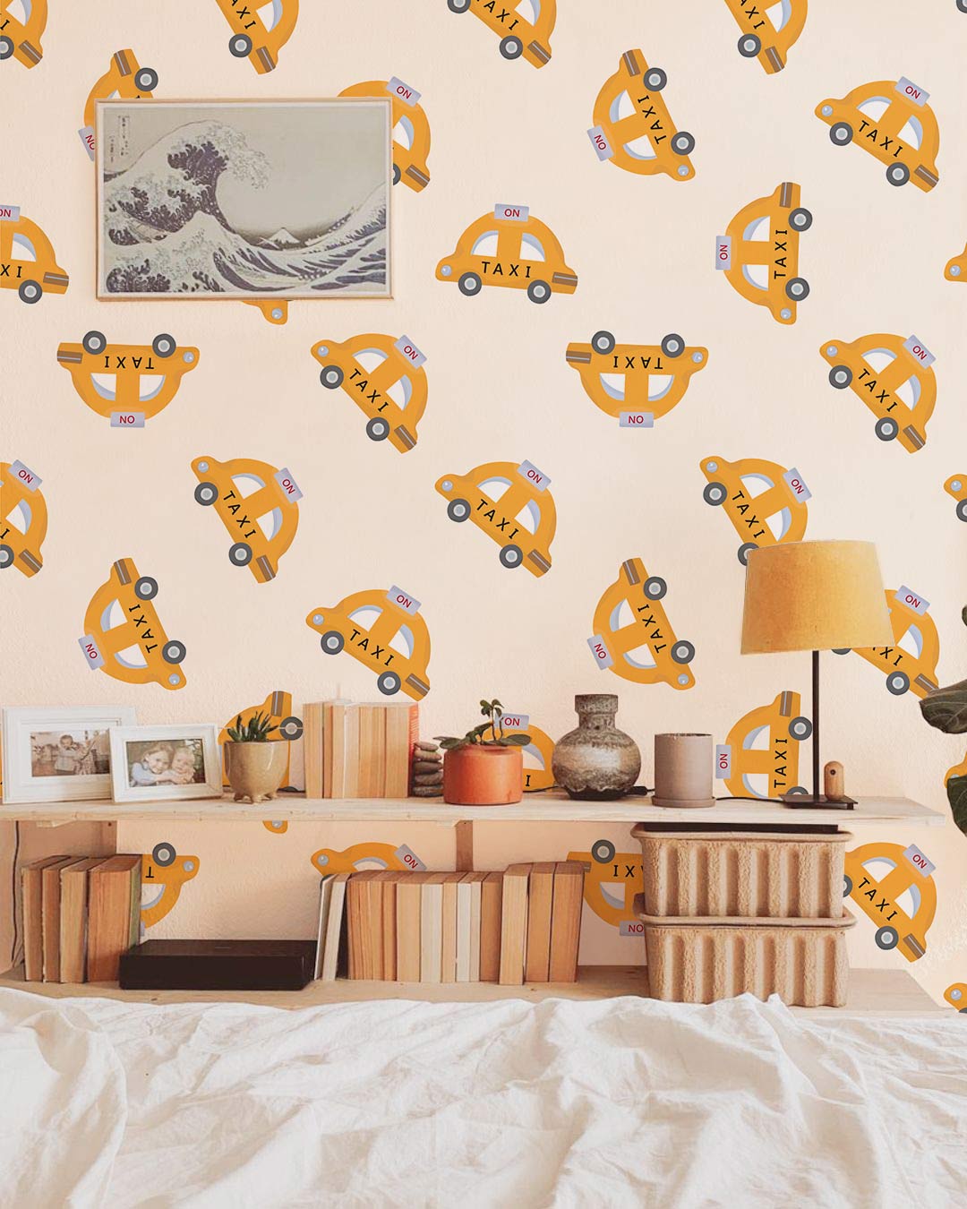 Retro yellow taxi pattern wallpaper in bedroom; vintage decor, wooden furniture, playful interior design.