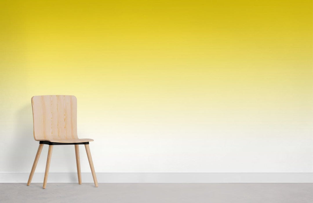 Sunshine Yellow Gradient Ombre Wallpaper in modern room with wooden chair and grey flooring.