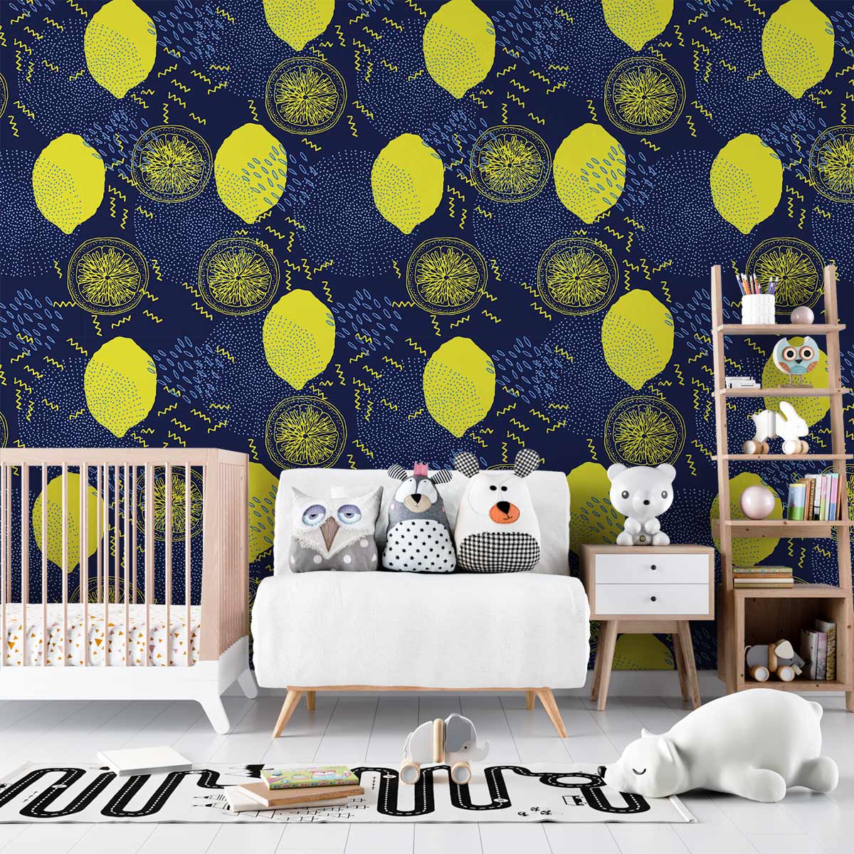 Vibrant citrus and navy geometric wallpaper in child's room with white crib, playful cushions, wooden ladder shelf.