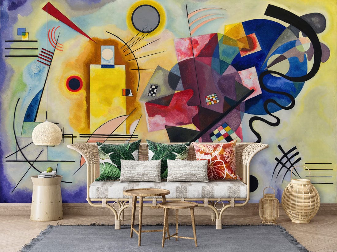 Vibrant Art Deco mural wallpaper with abstract shapes, colourful sofa, and wooden flooring in a lounge.