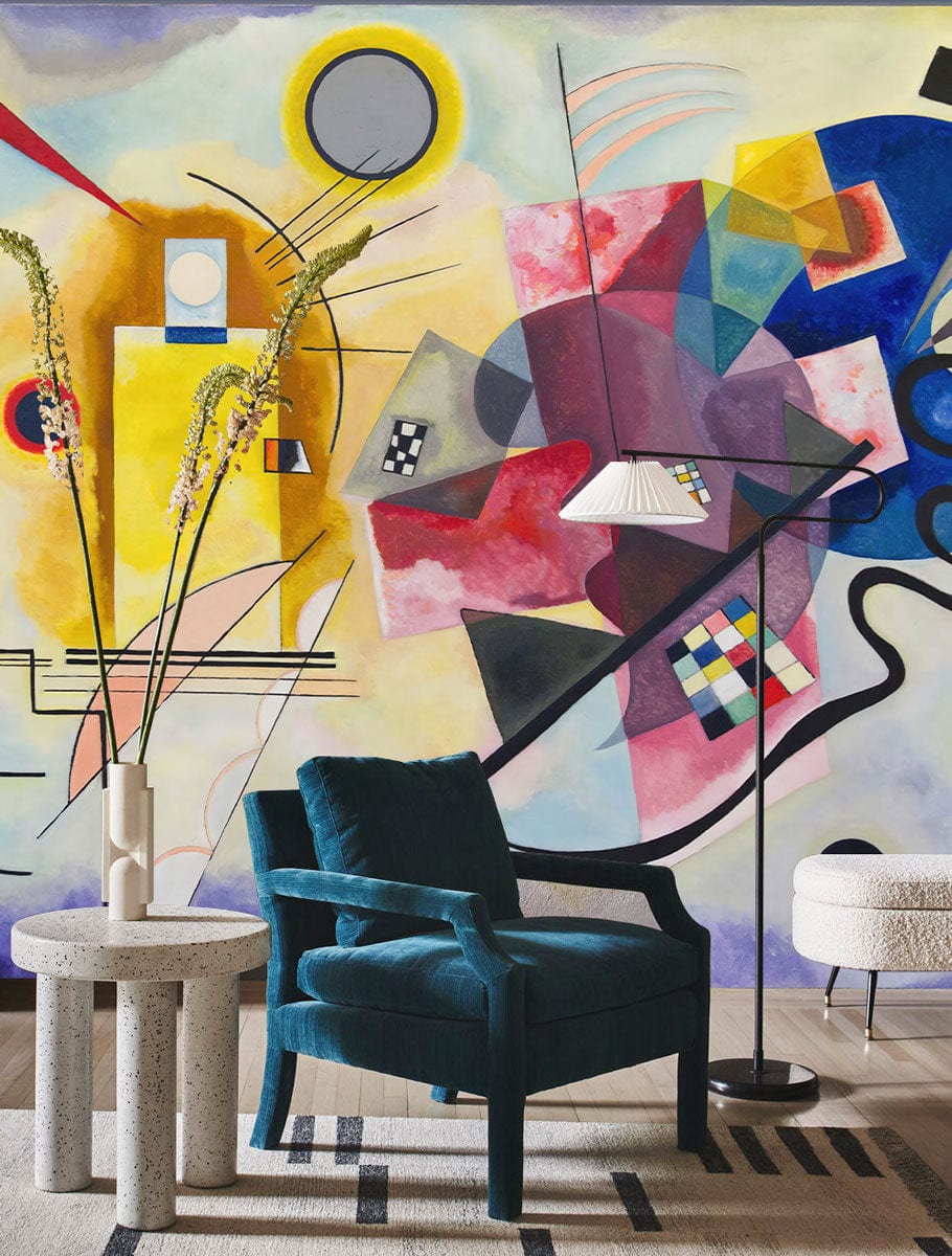 Vibrant Abstract Geometric Shapes Multicolour Art Deco Mural Wallpaper, teal armchair, modern lounge room.