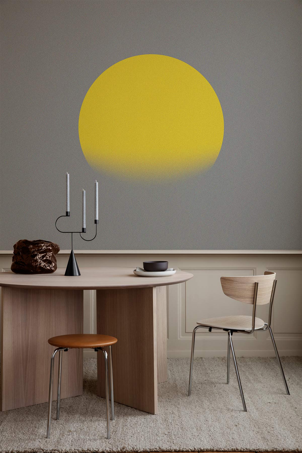 Elegant Yellow Sunrise Mural Wallpaper on minimalist grey wall, wooden dining furniture with neutral carpeting.