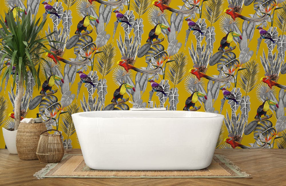 Tropical toucan wallpaper with mustard botanical design in bathroom, white tub, wooden flooring, plant Décor.