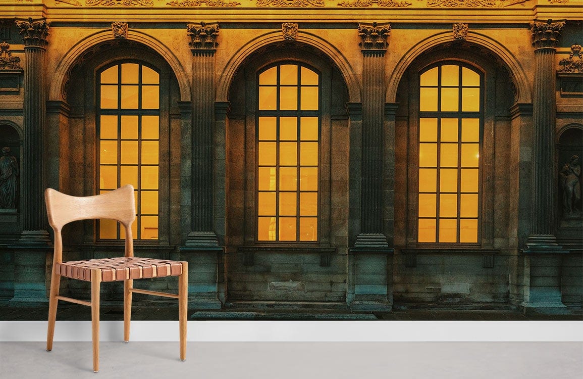 Elegant mural wallpaper with warm tones and architectural design, paired with a wooden chair, enhances living space.