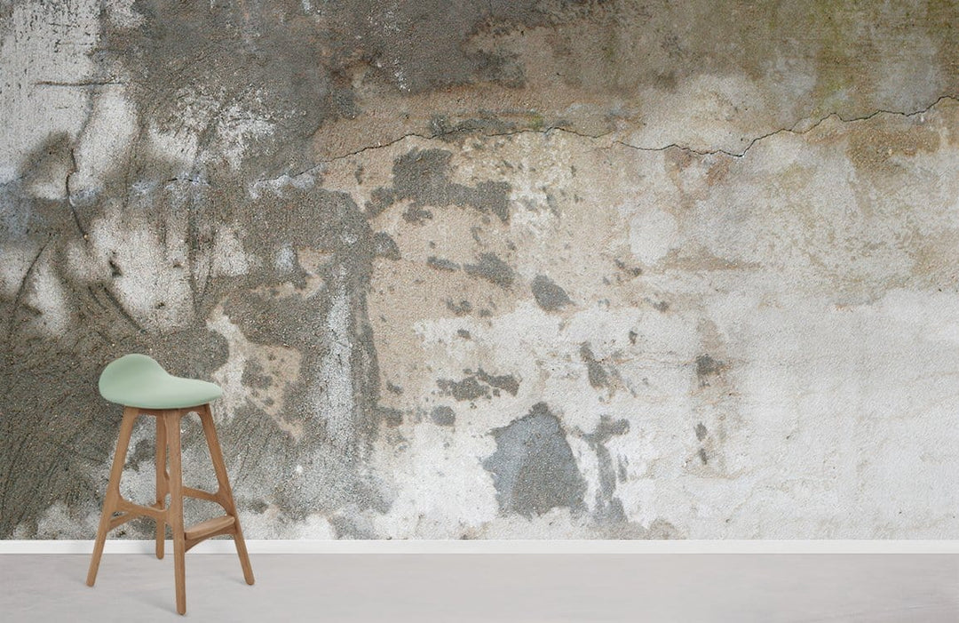 Vintage industrial mural wallpaper with neutral earth-tones, styled with wooden stool, concrete-style flooring.
