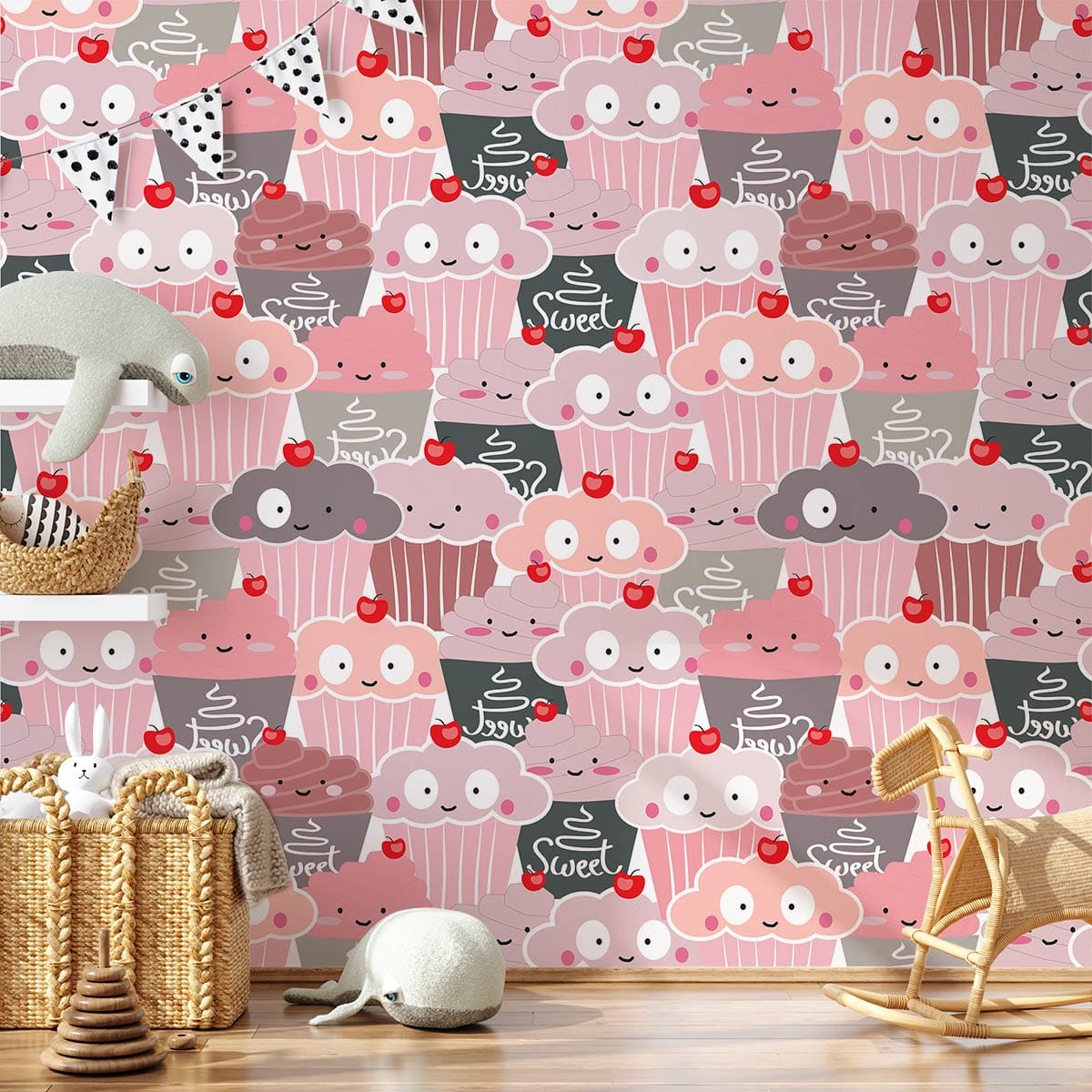 Adorable pastel cupcake mural wallpaper in child's bedroom with wicker baskets and playful wooden chair.